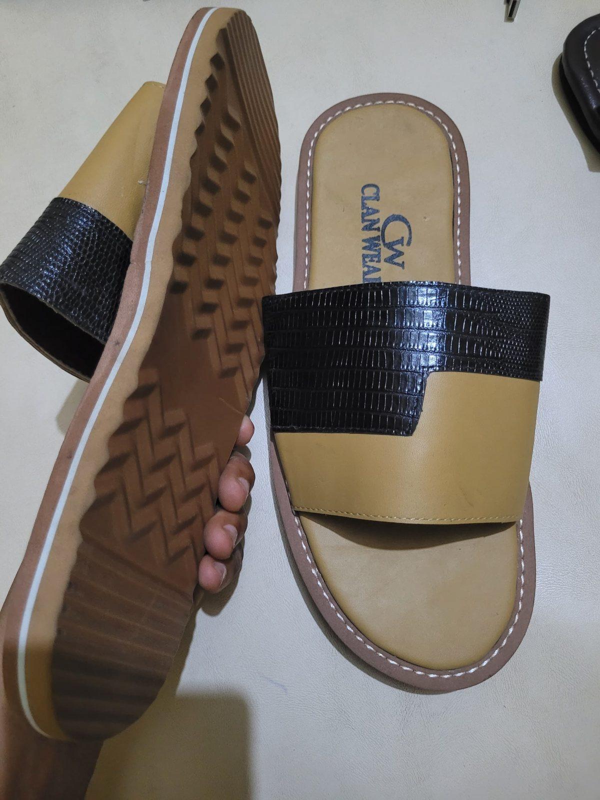 Tan slides with a black croc-effect strap