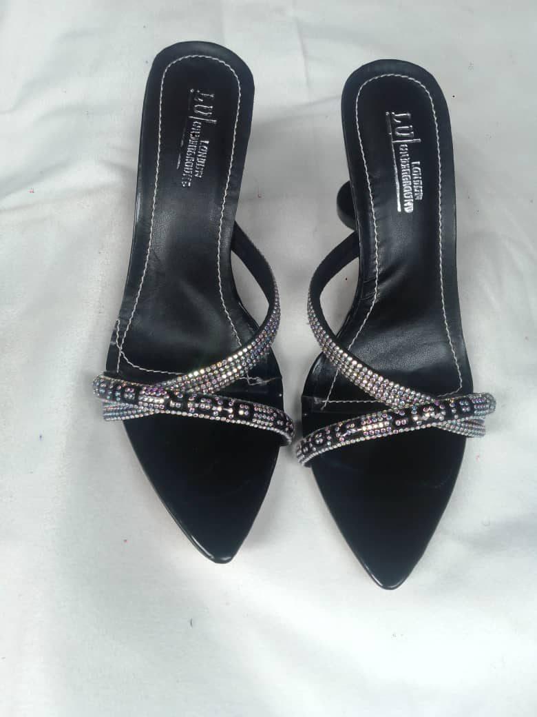 Black heels with stone-studded cross straps