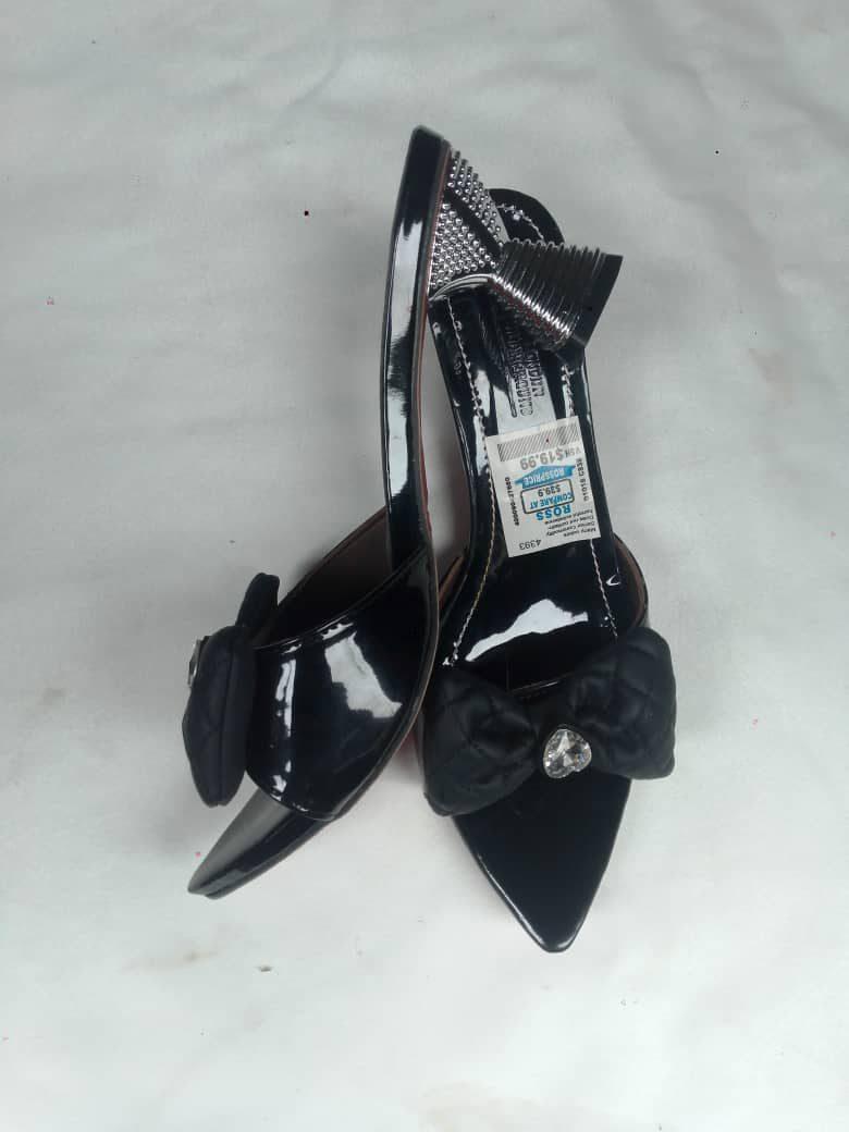 Black patent heels with a bow