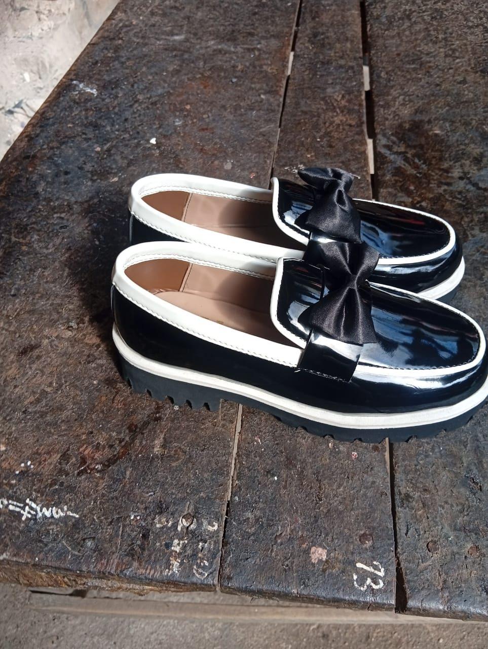 Patent loafers with a satin bow