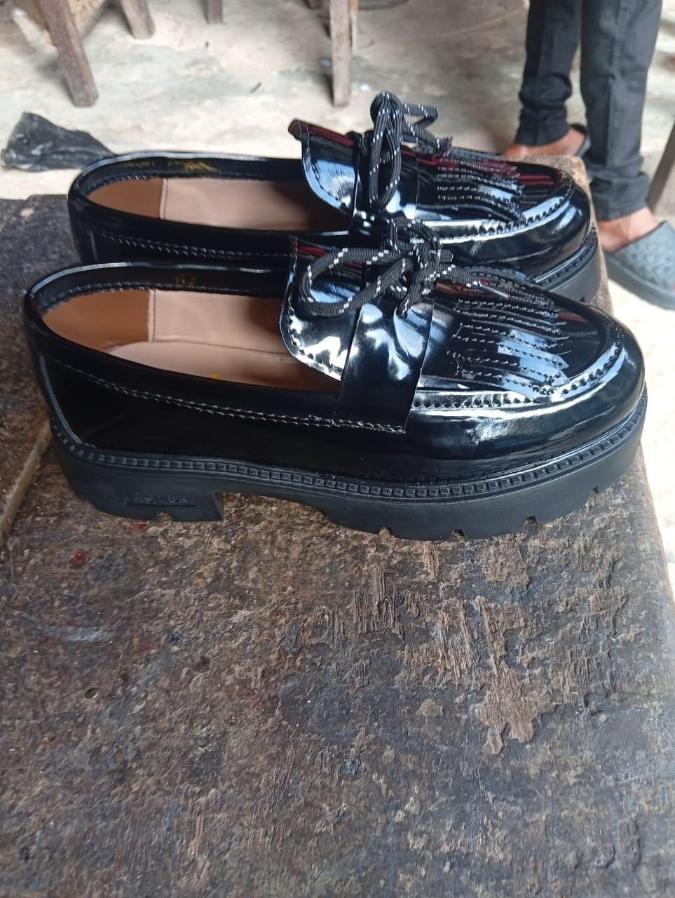 Patent tassel loafers on a chunky sole